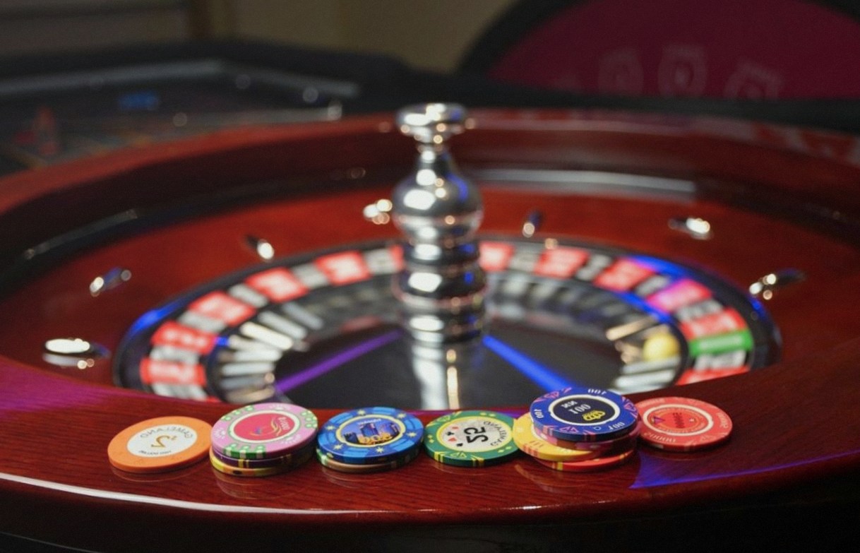 Poker table mid-hand in the Green Felt Room